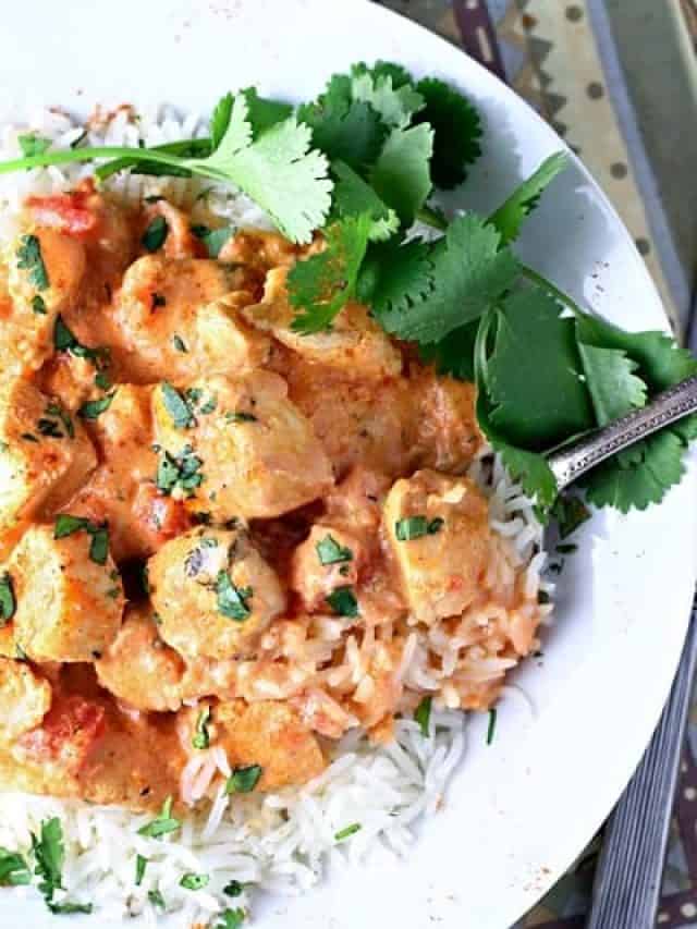 Butter chicken in a white bowl