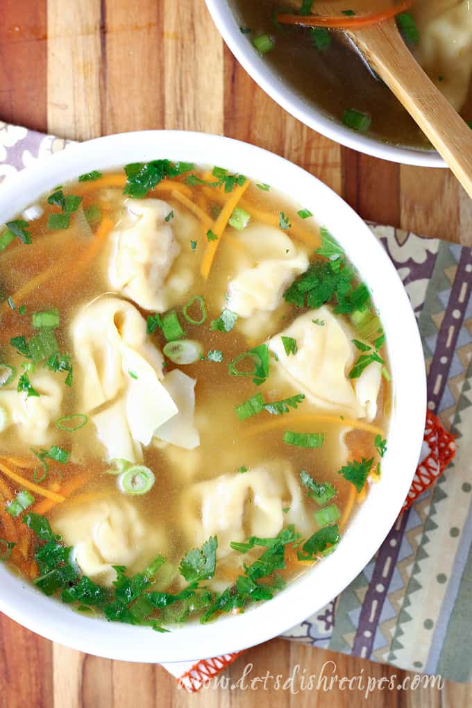 Wonton Soup with carrots and green onions.