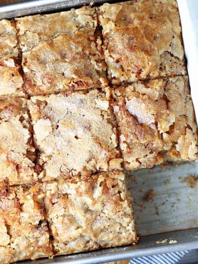 Banana bread cake in square pan with crunchy sugar topping.