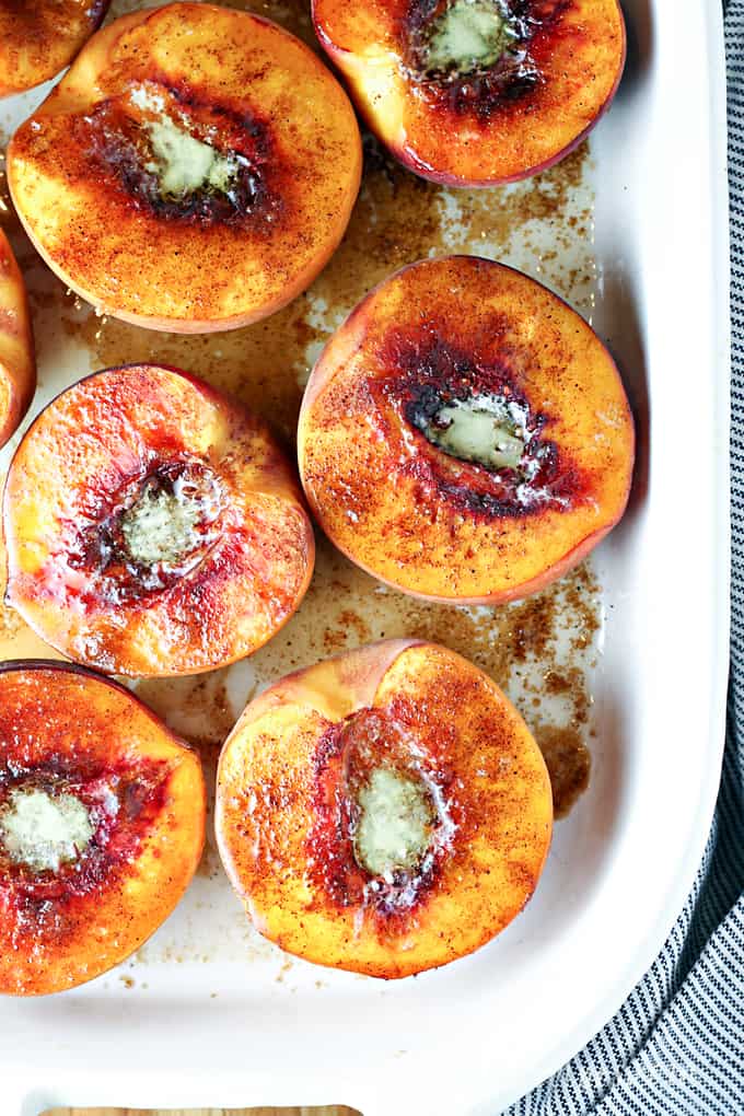 Fresh peaches are halved, sprinkled in brown sugar and spices, then baked.