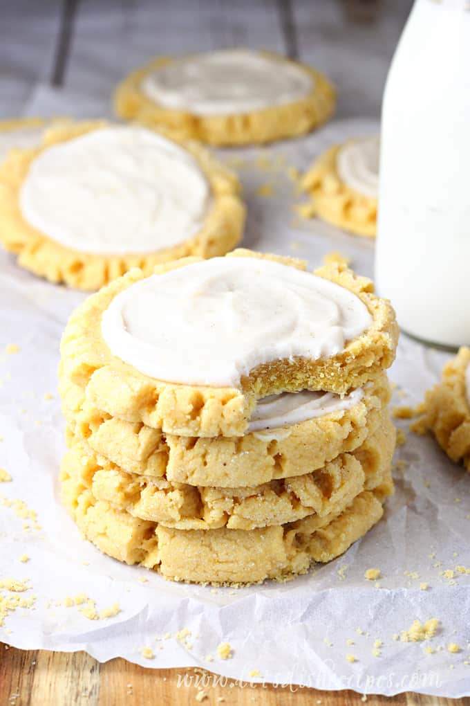 Frosted Pumpkin Sugar Cookies in a stack