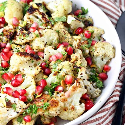 zaatar roasted cauliflower with pomegranates and pistachios feature