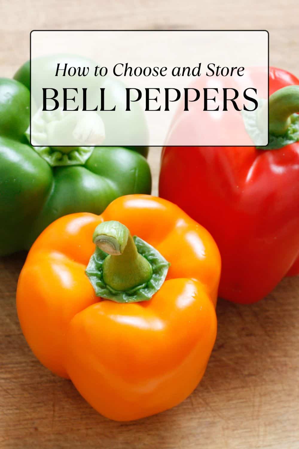 Colorful bell peppers on a cutting board.