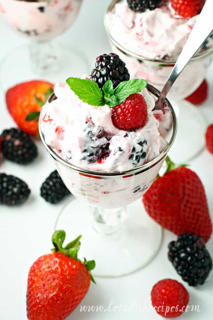 Dessert salad made with cream cheese, whipped cream and fresh berries.