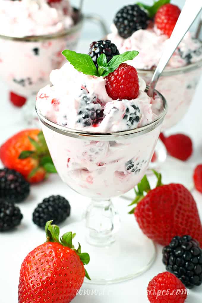 Dessert salad made with cream cheese, whipped cream and fresh berries.